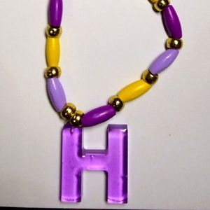 Letter H necklace with colored wooden beads